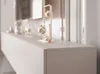 A close-up view of a modern TV lowboard with decorative elements on top. Produktbild-Vorschau