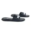 A pair of black Puma slide sandals with white Puma branding, shown on a white background. Anteprima dell’immagine prodotto