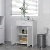 A white bathroom cabinet with its doors open, displaying shelves with towels and toiletries, placed in a bathroom setting with blinds and a trash can. Náhled obrázku produktu