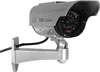 A silver dummy security camera with a black housing and lens, mounted on a silver bracket. Náhled obrázku produktu