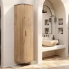 A modern bathroom with a wooden cabinet and a stone sink. Podgląd zdjęcia produktu