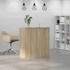 A reception desk with a chair and shelving unit in an office setting. Anteprima dell’immagine prodotto