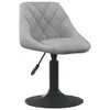 A light gray velvet dining chair with a diamond-stitched pattern on the seat and back, set against a white background. Produktbild-Vorschau
