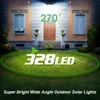 A solar light illuminates a lawn and the front of a house at night. Produktbild-Vorschau