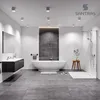A modern, minimalist bathroom with a freestanding bathtub, a wall-mounted vanity, and a walk-in shower. Produktbild-Vorschau