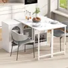 A white dining table with storage and chairs in a modern kitchen. Produktbild-Vorschau