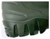 A close-up view of the sole and lower part of a green boot. Náhled obrázku produktu
