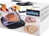 The image shows the packaging of a manual bread slicer, with a picture of the slicer in action and some sliced bread with ham on it. Náhled obrázku produktu