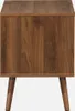 A close-up view of a wooden nightstand with a wood grain finish and angled legs. Produktbild-Vorschau