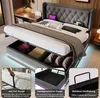 A modern upholstered bed with storage, featuring LED lighting and a tufted headboard. Anteprima dell’immagine prodotto