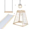 A collection of wooden indoor play equipment, including a swing, slide, climbing structure with a net and ladder, and gymnastic rings, arranged on a white background. Anteprima dell’immagine prodotto