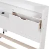 A close-up view of a white bed frame with an open drawer and wooden slats. Podgląd zdjęcia produktu