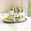A bar setup with drinks and a bottle opener on a tray. Podgląd zdjęcia produktu