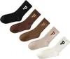 A set of five socks of different colors arranged diagonally. Podgląd zdjęcia produktu