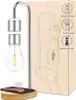A levitating LED night light with a wireless charging base, shown next to its packaging which illustrates its features. Náhled obrázku produktu
