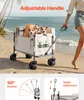 A person pulling a wagon with two dogs on a beach. Produktbild-Vorschau