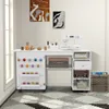 A white sewing cabinet with a sewing machine on top, organized with various sewing supplies. Voir les images du produit