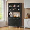 A black sideboard with glass doors and wooden legs in a kitchen or dining room setting. Náhľad obrázku produktu