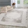 A rug is laid out on a wooden floor in a room with natural light coming from a window. Voir les images du produit