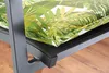 A close-up view of a chair cushion with a palm leaf pattern on a chair frame. Produktbild-Vorschau