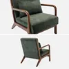 A studio shot of a green armchair with wooden legs and armrests, shown from two different angles. Produktbild-Vorschau