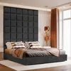 A bedroom scene with a bed and headboard. Anteprima dell’immagine prodotto
