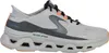 A side view of a single gray Skechers sneaker against a white background. Voir les images du produit