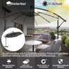 An outdoor patio scene with furniture and a large umbrella. Produktbild-Vorschau