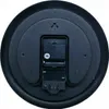 The back of a black wall clock showing the battery compartment and movement mechanism. Voir les images du produit