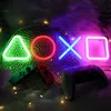 A gaming setup with neon lights and controllers. Produktbild-Vorschau