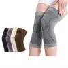 A group of knee braces in different colors are displayed next to a person wearing a pair of gray knee braces. Podgląd zdjęcia produktu