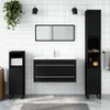 A modern black bathroom vanity set with a mirror, sink, and storage cabinets against a white tiled wall. Voir les images du produit