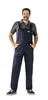 A man wearing navy blue overalls and a gray shirt, standing against a white background. Produktbild-Vorschau