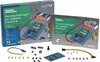 A product shot of an electronics learning kit, including its packaging and components, arranged on a light gray background. Produktbild-Vorschau