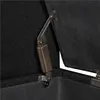 A close-up view of a hinge mechanism on a black fabric storage bench. Podgląd zdjęcia produktu