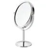 A silver makeup mirror on a stand against a white background. Produktbild-Vorschau