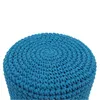 A close-up view of the top of a blue crocheted pouf. Náhled obrázku produktu