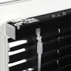 A close-up view of the top mechanism and cord of a black aluminum blind. Produktbild-Vorschau