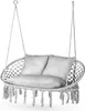 A white macrame hanging chair with two pillows and tassels, suspended by ropes against a white background. Voir les images du produit
