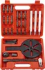 A tool kit for removing bearings, with various attachments and a central removal tool, laid out in an orange plastic case. Podgląd zdjęcia produktu