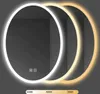 A round mirror with LED lighting, showing three different color temperatures. Náhled obrázku produktu