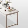 A white desk with a laptop, lamp, calendar, and a cup of coffee. Podgląd zdjęcia produktu