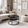 A modern living room scene with a sofa, coffee table, and artwork. Produktbild-Vorschau