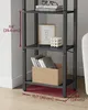 A close-up of a bookshelf with various items displayed on its shelves, including books, a framed picture, and a candle. Produktbild-Vorschau