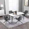 A dining set with a white marble-top table and four dark gray chairs in a well-lit room. Produktbild-Vorschau