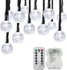 A string of solar-powered LED lights with a remote control and battery pack. Anteprima dell’immagine prodotto