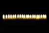 A row of lit LED candles against a black background. Produktbild-Vorschau