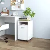 A white filing cabinet with wheels is placed next to a white desk, with books and a plant on top. Náhľad obrázku produktu