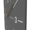 A close-up view of a modern square wall clock with wooden hands. Anteprima dell’immagine prodotto