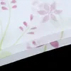 A close-up view of a sheer curtain with a floral pattern. Produktbild-Vorschau